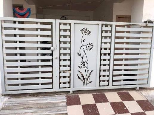 White enamel painted metal gate with floral design